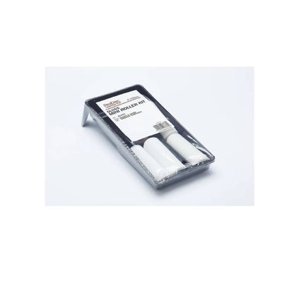Set of white rollers in a clear plastic case on a white background