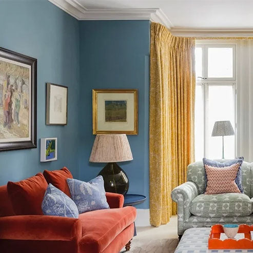 Living room walls painted with F&B Stone Blue